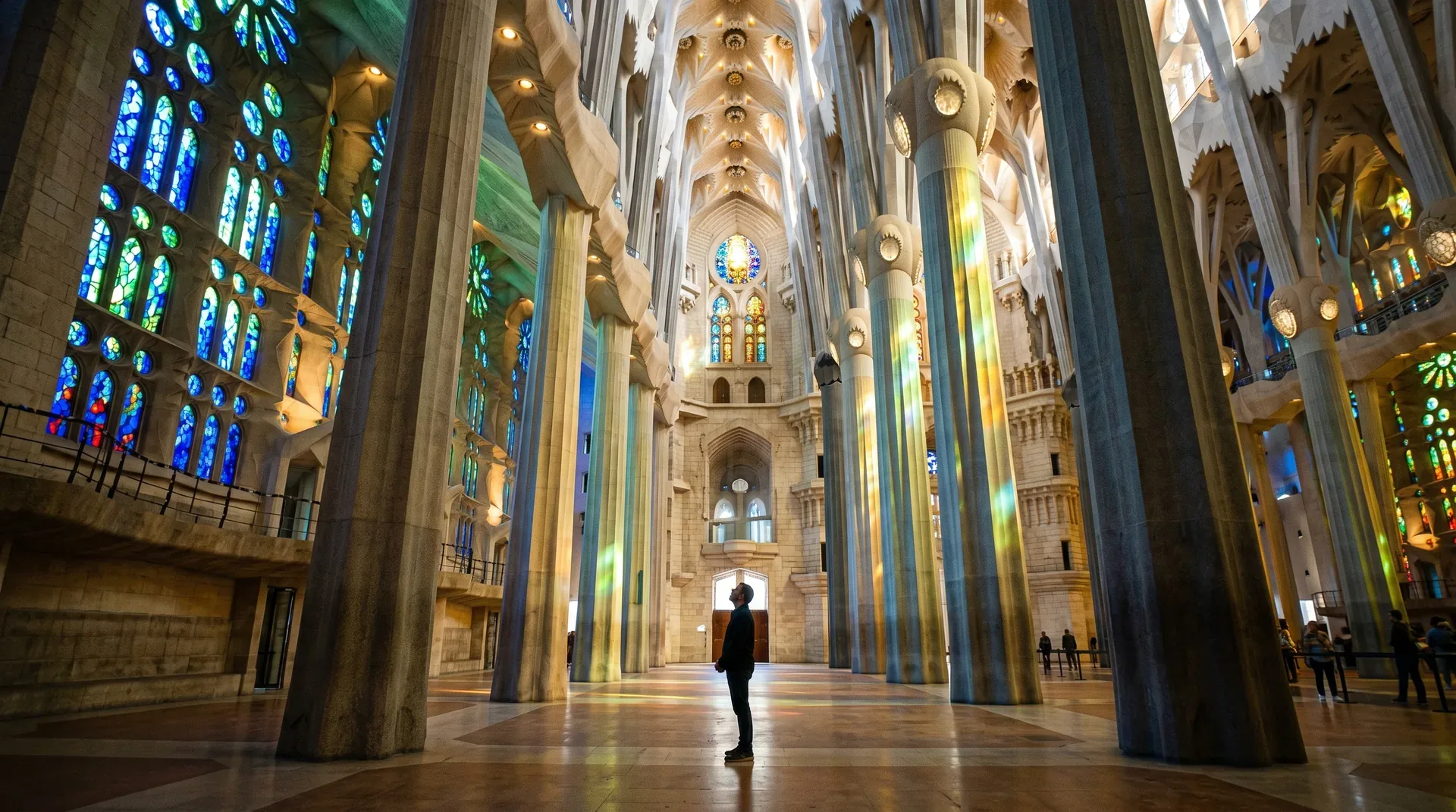 Morning light through the east stained glass windows of the Sagrada Família nave